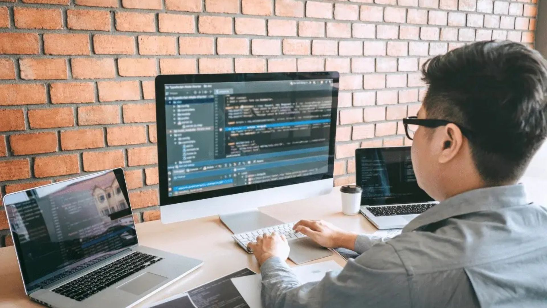 a man on a laptop using tools for web development